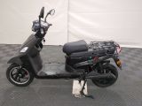 a scooter that is parked on a checkered floor