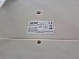 a close up of a white electronic device on a table