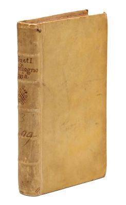 an old book sitting on top of a table next to a white background