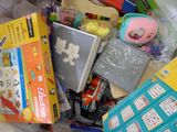 a pile of children ' s toys and toys in a bin