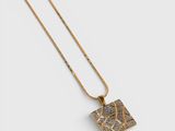 a gold necklace with a square pendant and a chain on a white background