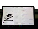 a laptop with a picture of a car on the screen
