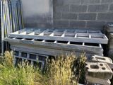 a pile of concrete blocks sitting next to a building