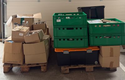 many boxes stacked on top of each other in a warehouse