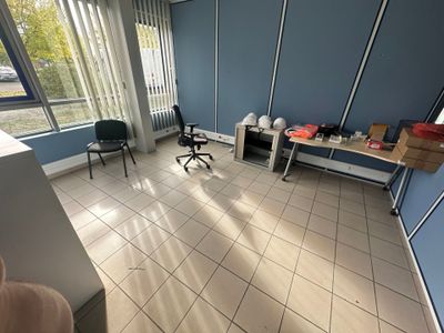 a room with a desk and a chair in it
