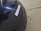 a sticker on the back of a motorcycle that is parked in a garage