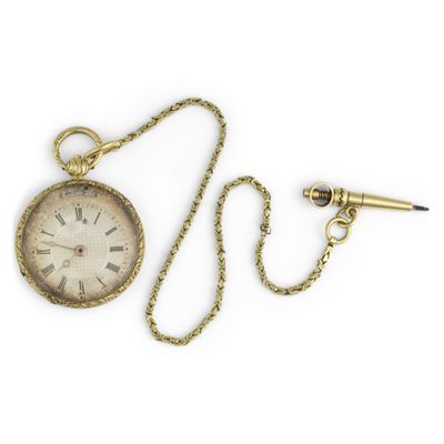 an antique pocket watch with a chain and a pen on a white background