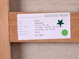 a label on the back of a wooden bench