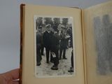 an old photo of a group of men standing in front of a crowd