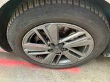 a close up of a tire on a car ' s rim