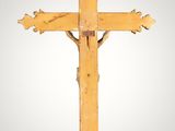 an old wooden cross on a white background with a gray background