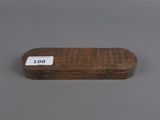 a small wooden box with a label on it