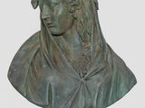 a bronze bust of a woman with a crown on her head