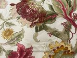 a close up of a floral print on a table cloth