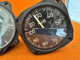two clocks that are sitting on an orange chair