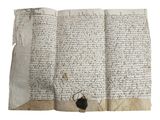 un ancien manuscrit comportant des inscriptions et muni d'un sceau de cire