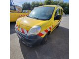 the yellow van is parked in the parking lot next to other vehicles