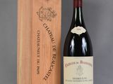 an image of a bottle of red wine next to a wooden box