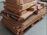 a pile of boxes sitting on a pallet in a garage