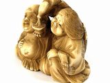 a statue of a woman and a child sitting on the ground