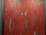 two red doors that are open in a room