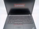 a laptop that has a lenovo logo on the screen