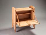 a small wooden desk with a shelf on it