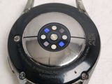 a close up of a watch on a white surface
