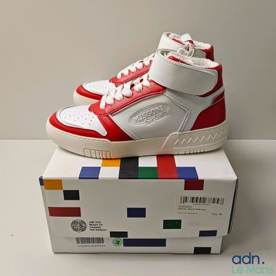a box with a pair of shoes on top of it