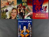 four books that are sitting on a table