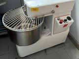 an image of a kitchen with a mixer and a counter