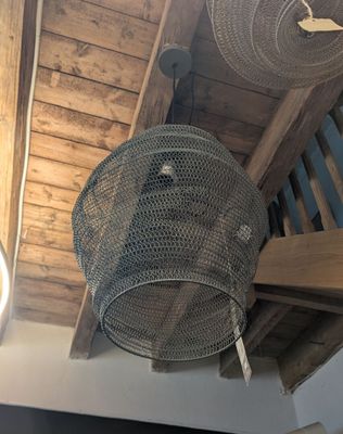 two baskets hanging from the ceiling of a room