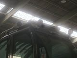 a man sitting on top of a vehicle in a building