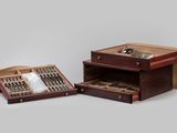 two wooden boxes with silverware in them on a table