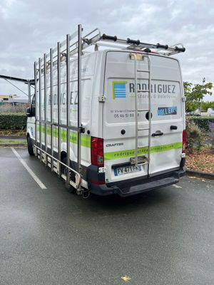 a white van that is parked in a parking lot