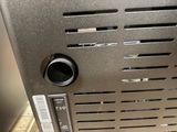 a close up of a toaster oven on a counter top
