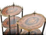 a three tiered table with a clock on top of it