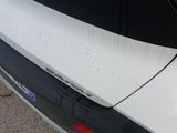 a close up of a car ' s rear end with a sticker on it