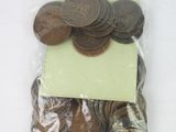 a bag of coins with a piece of paper on top of it