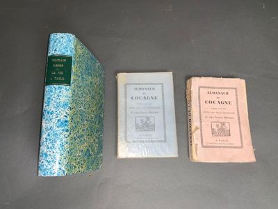 three books are sitting on a table next to each other