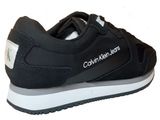 black and white sneakers with a logo on the side of the shoe