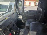 a view of the inside of a truck from the driver ' s seat