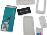 the contents of a medical kit are laid out on a white surface