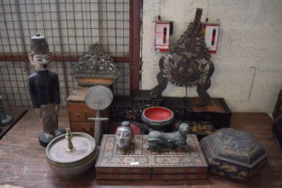 a wooden table with a lot of different items on it