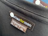 a label on the back of a jacket that says atlas for men