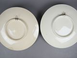 two white plates with a silver handle and a white plate with a silver handle and a white plate with a silver handle and a white plate with a silver handle