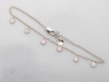 a close up of a silver chain bracelet with five charms on it