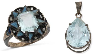 two rings and a pendant with a blue topazt stone