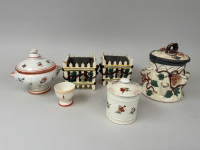 several different types of porcelain items are displayed on a table
