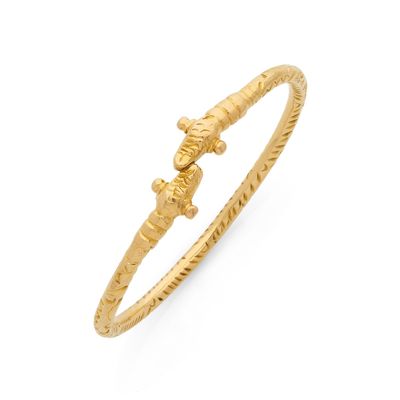 JONC orné de deux animaux fantastiques. Monture en or jaune …